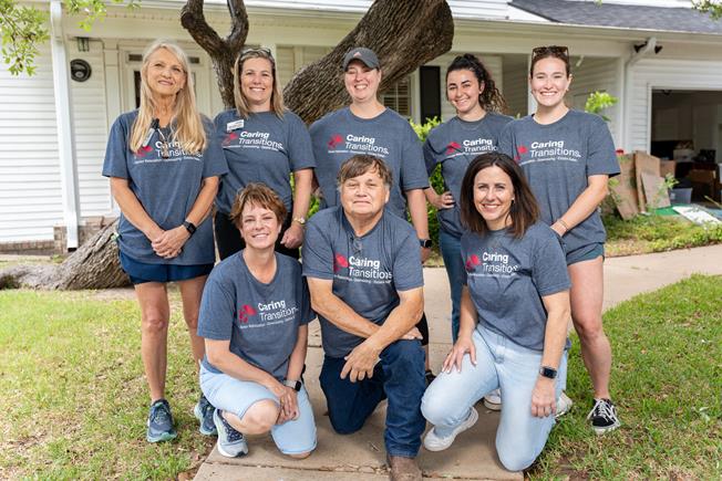 Caring Transitions of Brazos Valley & The Woodlands team in front of house.